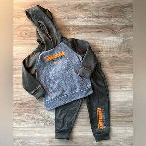 PUMA Kids' Green and Grey Tracksuit with Orange Accents.